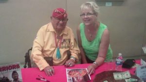Christy with WW2 Navajo code talker demonstrates about us